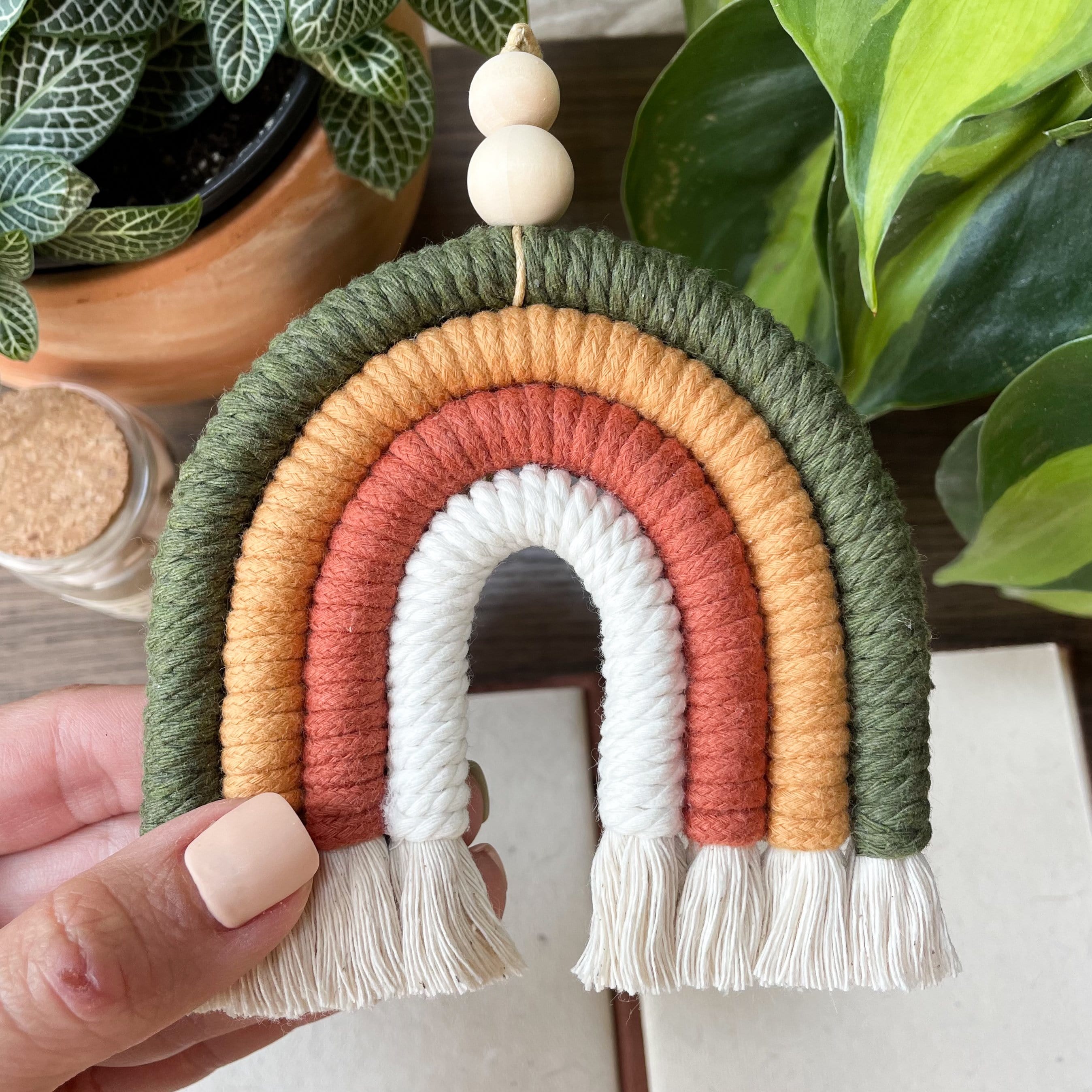 Rainbow Macrame Wall Hanging in white, orange, yellow, and olive green